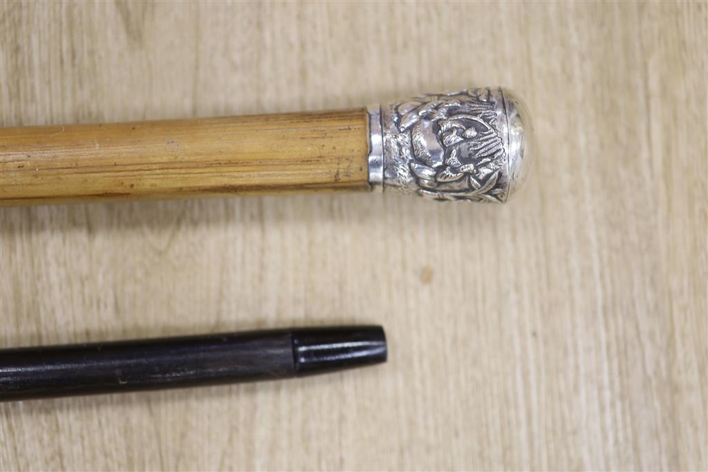 A Chinese silver-mounted malacca cane and a plate mounted ebonised stick